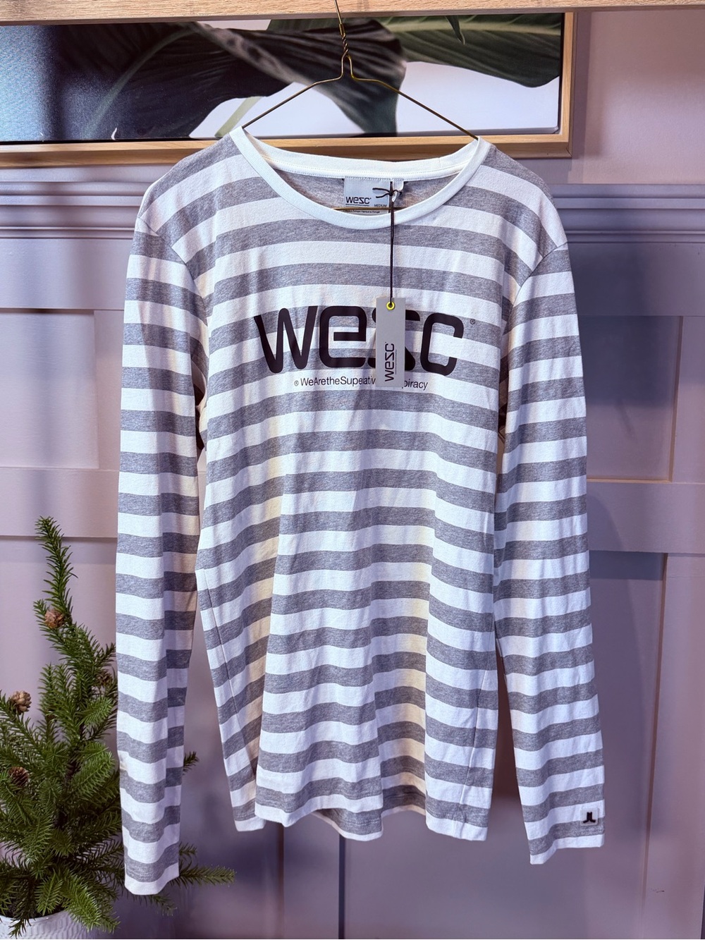 WeSC gray-and-white striped long-sleeve tee features a prominent chest logo M